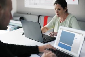 woman using laptop to study